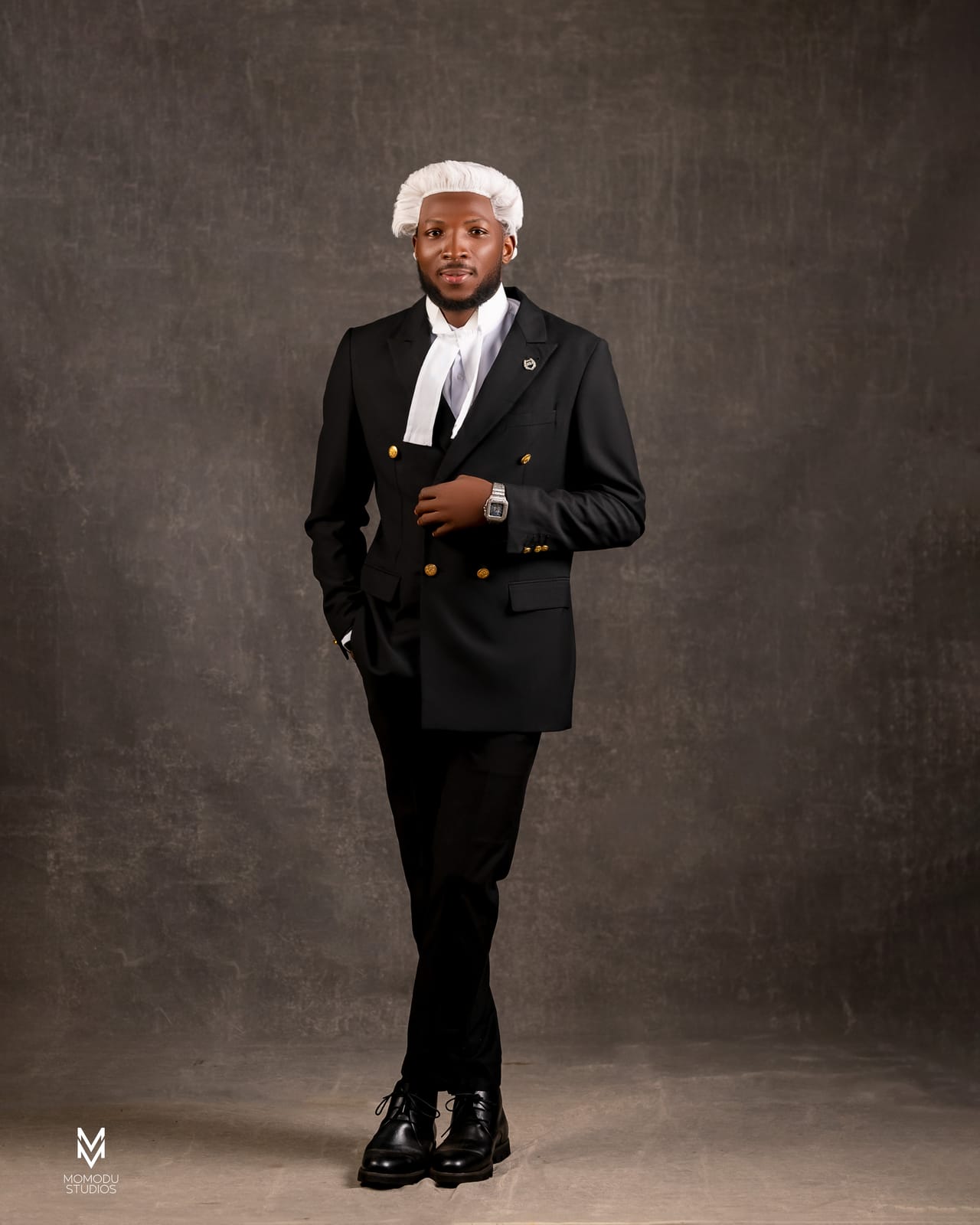 A new lawyer in wig and double-breasted suit standing full length